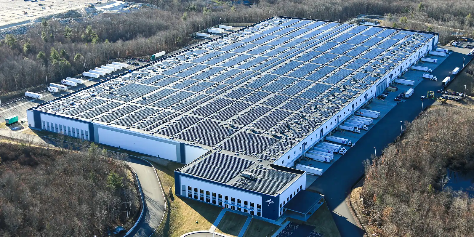Heavy industrial factory floor with high power electrical systems and solar infrastructure